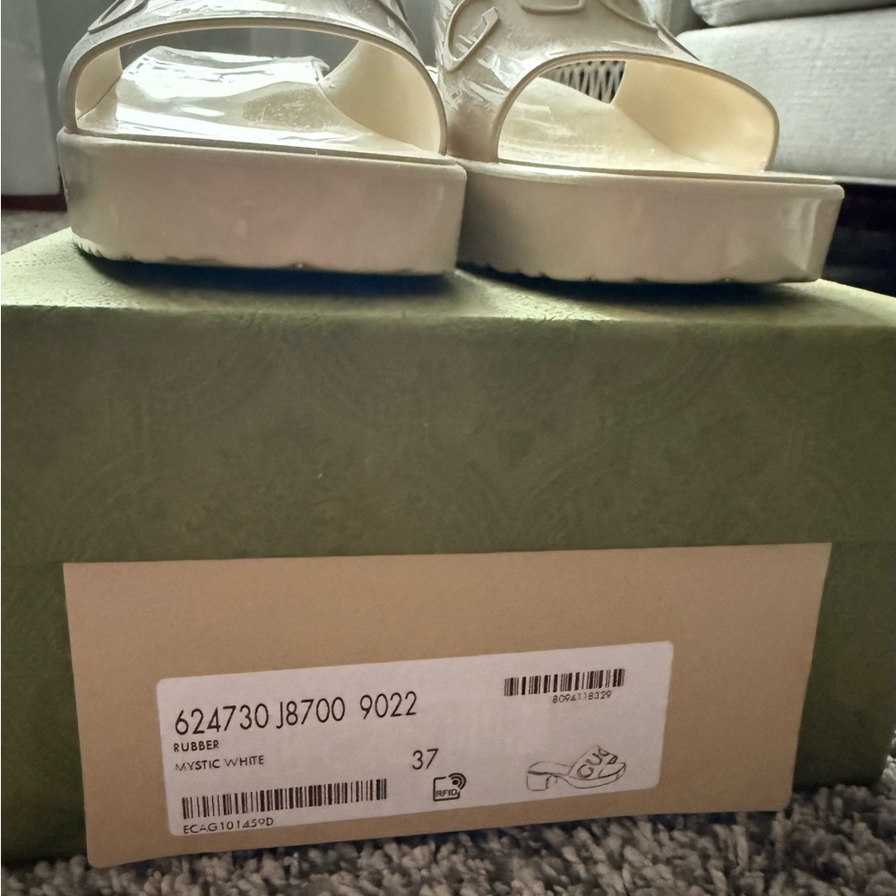 Gucci Cream Embossed Logo Slide Sandals - Picture 12 of 16